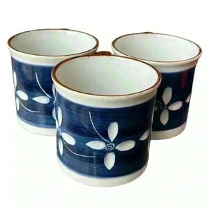 Set of 3 vintage carved cobalt blue stoneware mugs with floral motif